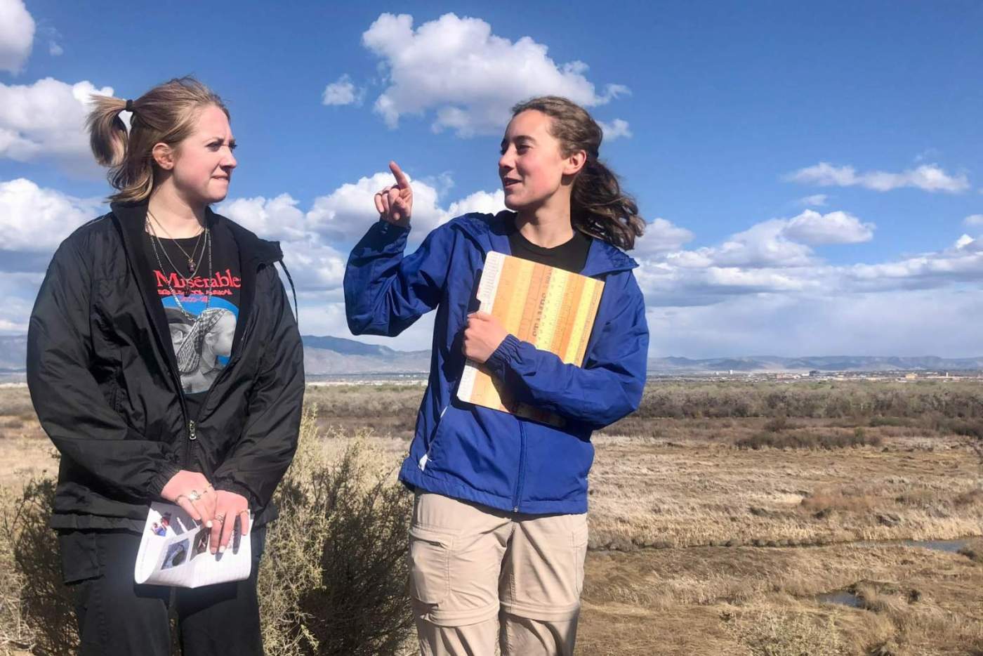 2 young woman talk outside